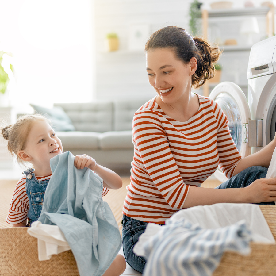 woman and child do laundry